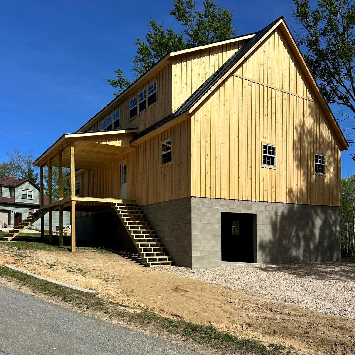 A Stunning 30x50 Two-Story Gable Cabin with a Spacious Covered Porch