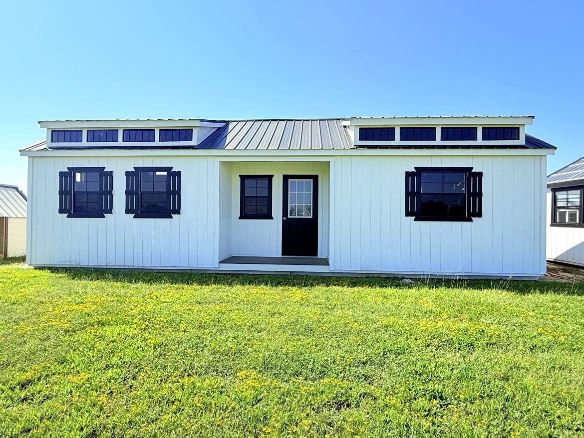 Exploring the 16x36 Center Cabin: Recessed Porch and Open Concept Layout