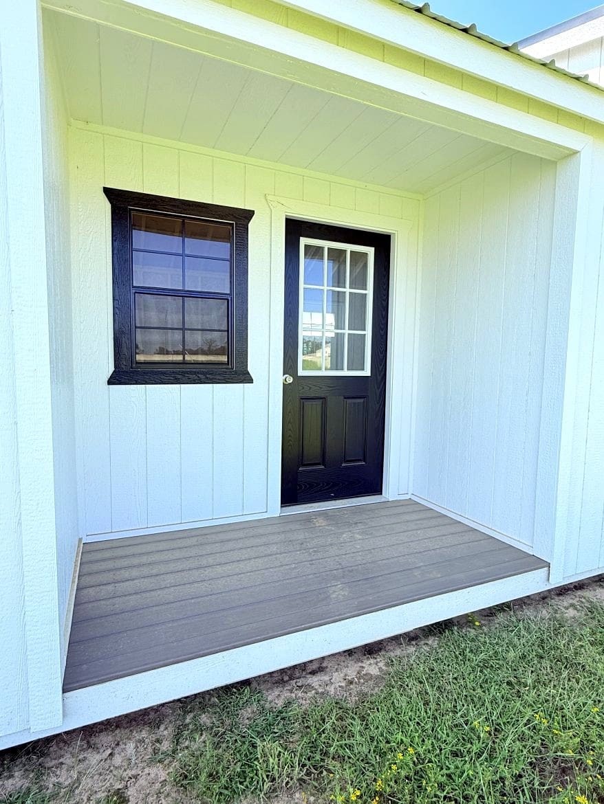 Exploring the 16x36 Center Cabin: Recessed Porch and Open Concept Layout
