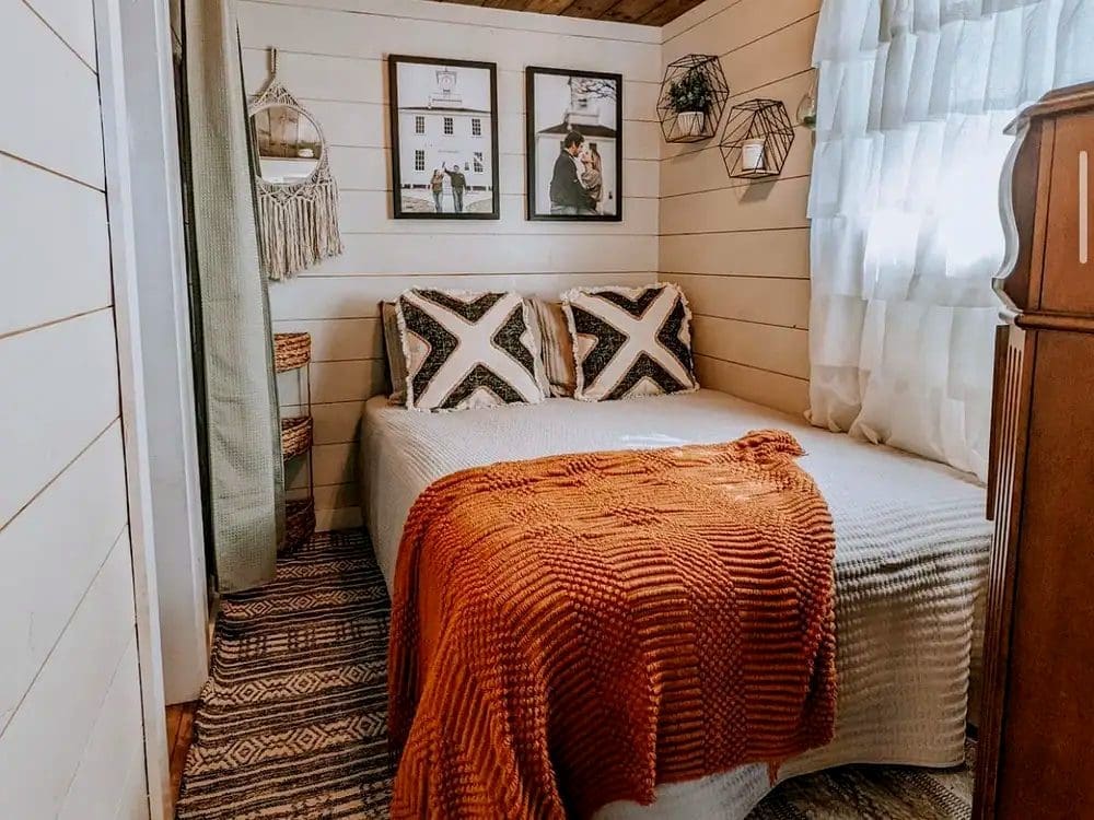 Bright Shiplap Walls and Wood Laminate Flooring